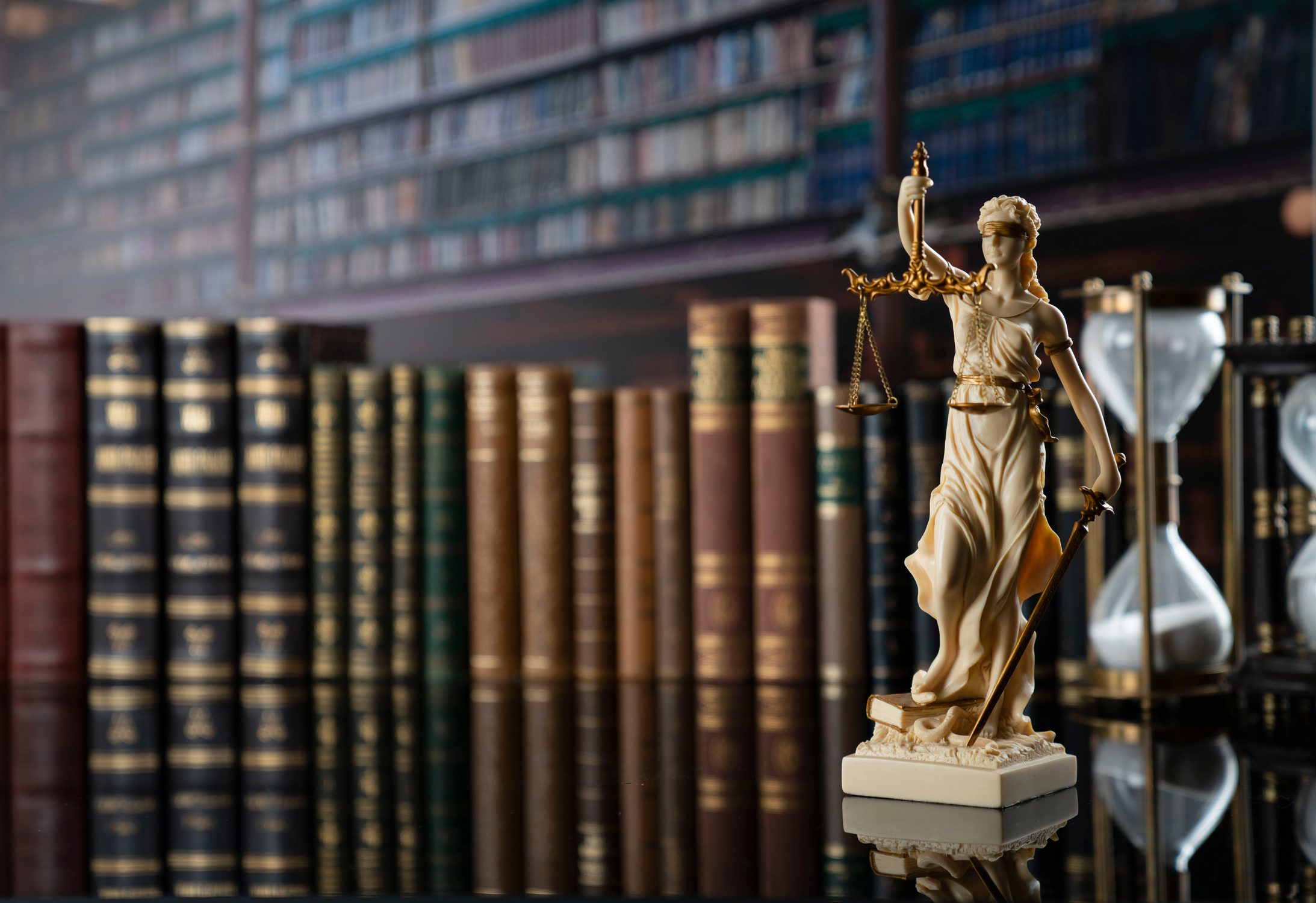 Law library with bound reporters and scales of justice